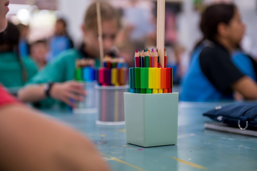 Image of colouring pens on a class table