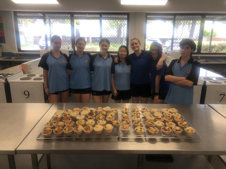 Senior School Service Learning Students with muffins