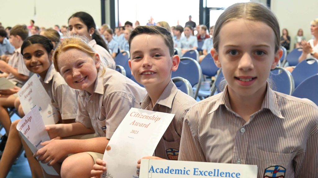 A photo of Tranby students holding up their achievement awards.